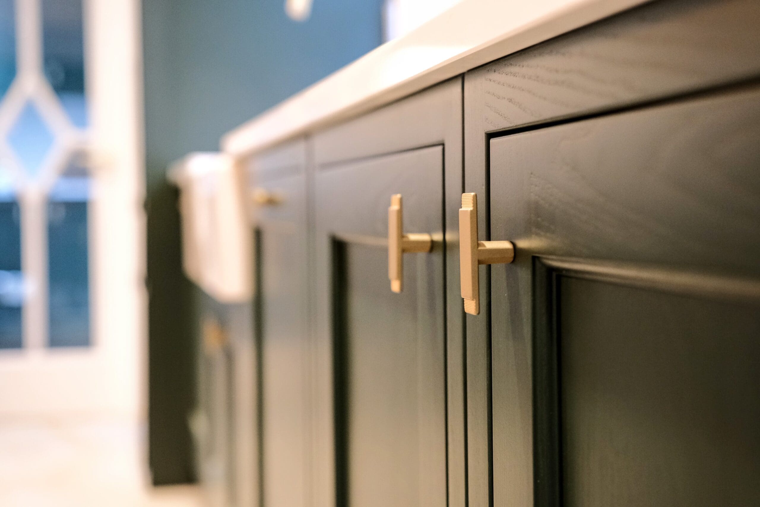 In-frame Cabinet door with satin brass handles